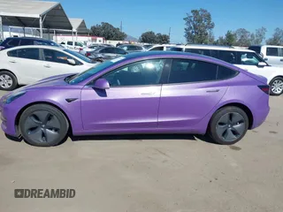2020 Tesla Model 3 Standard Range Plus with VIN 5YJ3E1EA0LF739462, listed as a IAAI auction lot 42081889 with 65,254 mi miles. Bid and sale history available at carsss.com. Image 14.