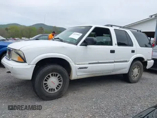 1999 GMC Jimmy SLE with VIN 1GKDT13WXX2521082, listed as a IAAI auction lot 42079903 with 160,055 mi miles. Bid and sale history available at carsss.com. Image 6.