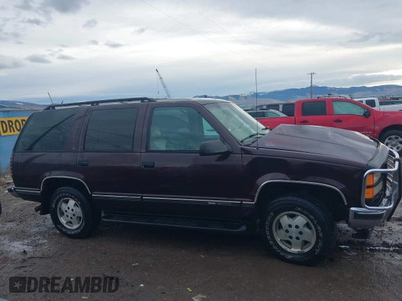 1997 GMC Yukon with VIN 1GKEK13R0VJ755574, listed as a IAAI auction lot 41158932 with 212,668 mi miles. Bid and sale history available at carsss.com. Image 14.
