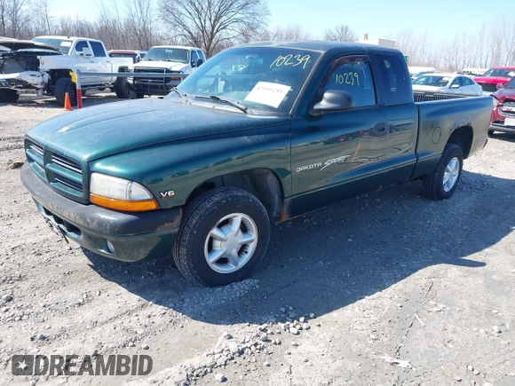 1999 Dodge Dakota SLT z VIN 1B7GL22X0XS128071, wystawiony jako IAAI lot #42010239 z przebiegiem 150 495 mil mil oraz . Historia ofert i sprzedaży dostępna na DreamBid. Obrazek 2.
