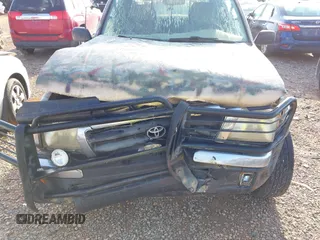 1999 Toyota Tacoma z VIN 4TAWM72N5XZ429880, wystawiony jako IAAI lot #42179697 z przebiegiem 311 261 mil mil oraz . Historia ofert i sprzedaży dostępna na DreamBid. Obrazek 6.