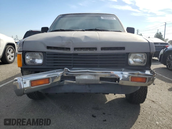 1987 Nissan Hardbody E z VIN JN6ND11SXHW014073, wystawiony jako Copart lot #78956934 z przebiegiem 381 885 mil mil oraz Szkody całkowita. Historia ofert i sprzedaży dostępna na DreamBid. Obrazek 5.