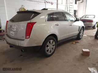 2014 Cadillac SRX Luxury Collection with VIN 3GYFNEE35ES681424, listed as a IAAI auction lot 41854969 with 135,163 mi miles. Bid and sale history available at carsss.com. Image 4.
