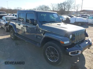 2021 Jeep Gladiator Overland z VIN 1C6HJTFG0ML507773, wystawiony jako IAAI lot #41617970 z przebiegiem 95 816 mil mil oraz . Historia ofert i sprzedaży dostępna na DreamBid. Obrazek 1.