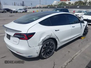 2021 Tesla Model 3 Performance with VIN 5YJ3E1EC2MF084594, listed as a IAAI auction lot 42030339 with 43,215 mi miles and . Bid and sale history available at DreamBid. Image 4.