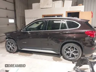 2016 BMW X1 xDrive28i with VIN WBXHT3C33GP886935, listed as a IAAI auction lot 41707367 with 73,201 mi miles. Bid and sale history available at carsss.com. Image 15.