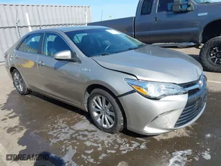 2015 Toyota Camry Hybrid LE with VIN 4T1BD1FK1FU174975, listed as a IAAI auction lot 42085034 with 54,728 mi miles. Bid and sale history available at carsss.com. Image 1.