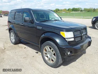 2011 Dodge Nitro Heat with VIN 1D4PU4GX9BW607580, listed as a IAAI auction lot 42105529 with 143,795 mi miles. Bid and sale history available at carsss.com. Image 1.