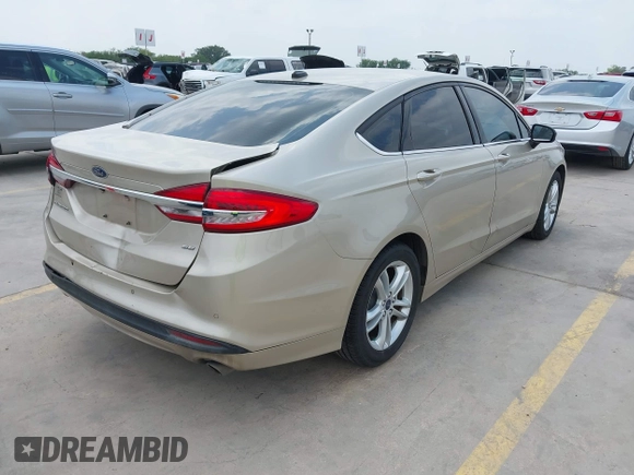 2018 Ford Fusion SE z VIN 3FA6P0H75JR176394, wystawiony jako IAAI lot #42169780 z przebiegiem 65 617 mil mil oraz . Historia ofert i sprzedaży dostępna na DreamBid. Obrazek 4.