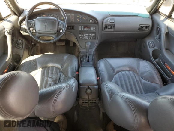 1999 Pontiac Bonneville SE z VIN 1G2HX52K3XH226172, wystawiony jako Copart lot #71655164 z przebiegiem 242 429 mil mil oraz Szkoda całkowita • Salvage title. Historia ofert i sprzedaży dostępna na DreamBid. Obrazek 8.