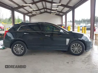 2014 Cadillac SRX Luxury Collection z VIN 3GYFNEE36ES677883, wystawiony jako IAAI lot #42260861 z przebiegiem 51 730 mil mil oraz . Historia ofert i sprzedaży dostępna na DreamBid. Obrazek 13.