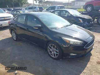 2015 Ford Focus SE z VIN 1FADP3F25FL284097, wystawiony jako IAAI lot #42553323 z przebiegiem 139 647 mil mil oraz . Historia ofert i sprzedaży dostępna na DreamBid. Obrazek 1.