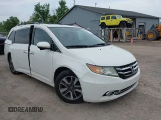 2015 Honda Odyssey Touring Elite with VIN 5FNRL5H94FB063997, listed as a IAAI auction lot 42516086 with 205,606 mi miles and . Bid and sale history available at DreamBid. Image 1.