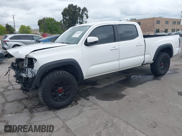 2021 Toyota Tacoma SR5 z VIN 3TMDZ5BN2MM100245, wystawiony jako IAAI lot #42078914 z przebiegiem 58 153 mil mil oraz . Historia ofert i sprzedaży dostępna na DreamBid. Obrazek 2.