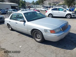 2002 Mercury Grand Marquis LS Premium z VIN 2MEFM75W82X653148, wystawiony jako IAAI lot #42307985 z przebiegiem 92 233 mil mil oraz . Historia ofert i sprzedaży dostępna na DreamBid. Obrazek 1.