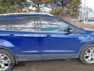 2016 Ford Escape Titanium with VIN 1FMCU9JX5GUA96563, listed as a IAAI auction lot 41695524 with 76,992 mi miles. Bid and sale history available at carsss.com. Image 14.