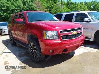 2013 Chevrolet Tahoe LT z VIN 1GNSCBE09DR366200, wystawiony jako IAAI lot #42082032 z przebiegiem 143 253 mil mil oraz . Historia ofert i sprzedaży dostępna na DreamBid. Obrazek 1.