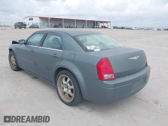 2006 Chrysler 300 with VIN 2C3KA43R56H217771, listed as a IAAI auction lot 41859397 with 154,227 mi miles. Bid and sale history available at carsss.com. Image 3.