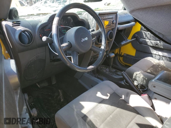 2008 Jeep Wrangler Unlimited X with VIN 1J4GA39158L621957, listed as a Copart auction lot 52737815 with 135,489 mi miles and Salvage title. Bid and sale history available at DreamBid. Image 8.