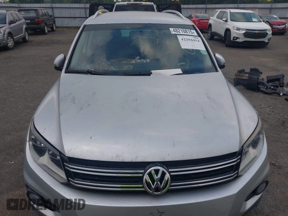 2012 Volkswagen Tiguan SE z VIN WVGAV7AX4CW520340, wystawiony jako IAAI lot #42294414 z przebiegiem 120 009 mil mil oraz . Historia ofert i sprzedaży dostępna na DreamBid. Obrazek 13.