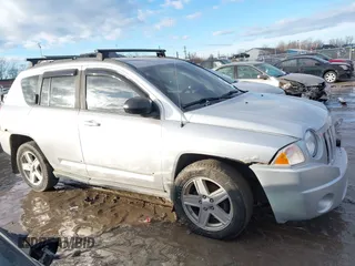 2010 Jeep Compass Sport with VIN 1J4NF4FB3AD589361, listed as a IAAI auction lot 41449412 with 127,807 mi miles. Bid and sale history available at carsss.com. Image 12.