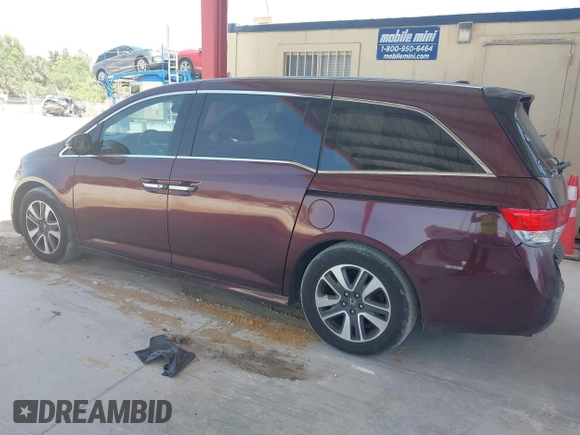 2014 Honda Odyssey Touring with VIN 5FNRL5H90EB080889, listed as a IAAI auction lot 42085305 with 123,286 mi miles and . Bid and sale history available at carsss.com. Image 14.