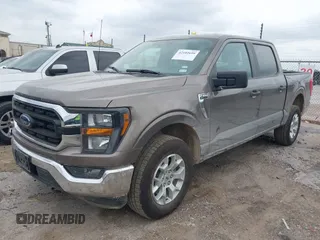 2023 Ford F-150 XL with VIN 1FTFW1E81PFB71702, listed as a IAAI auction lot 42102699 with 57,007 mi miles. Bid and sale history available at carsss.com. Image 2.