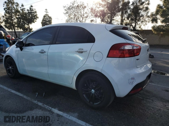 2015 Kia Rio LX with VIN KNADM5A39F6460207, listed as a Copart auction lot 44464245 with 106,792 mi miles and Salvage Title. Bid and sale history available at carsss.com. Image 2.