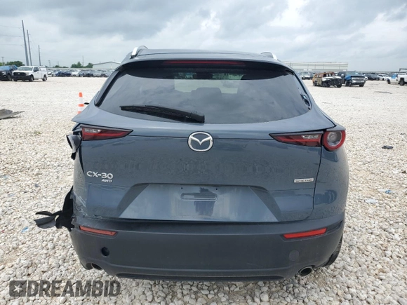 2023 Mazda CX-30 S Carbon Edition z VIN 3MVDMBCM2PM539130, wystawiony jako Copart lot #54817735 z przebiegiem 29 678 mil mil oraz Szkoda całkowita • Salvage title. Historia ofert i sprzedaży dostępna na DreamBid. Obrazek 6.