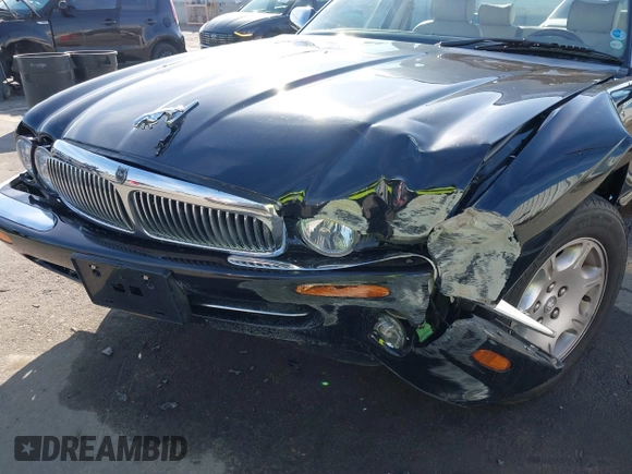 2003 Jaguar XJ 8 with VIN SAJDA14C03LF58706, listed as a IAAI auction lot 41619740 with 95,293 mi miles and . Bid and sale history available at DreamBid. Image 6.
