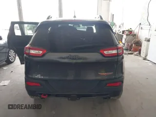 2016 Jeep Cherokee Trailhawk with VIN 1C4PJMBS0GW169184, listed as a IAAI auction lot 42255346 with 152,802 mi miles and . Bid and sale history available at DreamBid. Image 16.