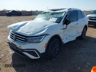 2022 Volkswagen Tiguan SE with VIN 3VV2B7AX2NM010932, listed as a IAAI auction lot 42007364 with 26,014 mi miles and . Bid and sale history available at DreamBid. Image 6.