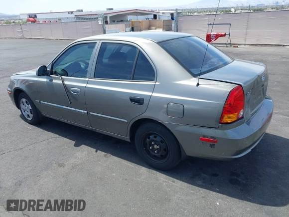 2003 Hyundai Accent GL with VIN KMHCG45C73U471607, listed as a IAAI auction lot 41956551 with 222,305 mi miles. Bid and sale history available at carsss.com. Image 3.