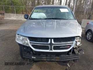 2015 Dodge Journey SE z VIN 3C4PDCAB3FT641675, wystawiony jako IAAI lot #41898611 z przebiegiem 218 121 mil mil oraz . Historia ofert i sprzedaży dostępna na DreamBid. Obrazek 13.