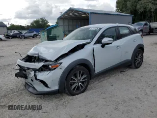 2017 Mazda CX-3 Touring z VIN JM1DKDC72H0150814, wystawiony jako Copart lot #57727405 z przebiegiem 94 361 mil mil oraz Szkoda całkowita • Salvage title. Historia ofert i sprzedaży dostępna na DreamBid. Obrazek 1.