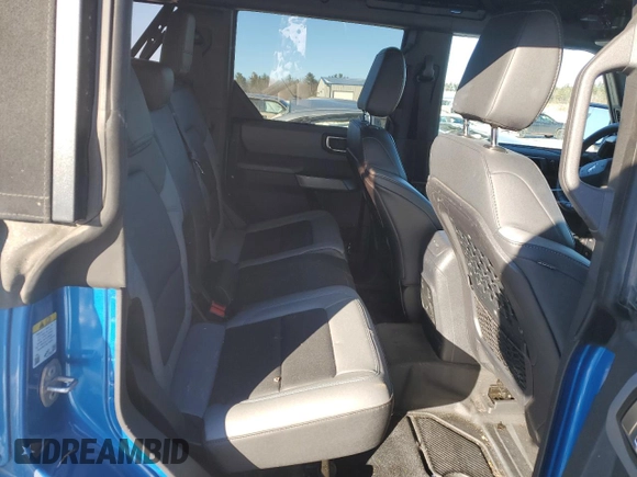 2023 Ford Bronco with VIN 1FMDE5BH0PLB15673, listed as a Copart auction lot 87823915 with 24,749 mi miles and Salvage Title. Bid and sale history available at DreamBid. Image 11.