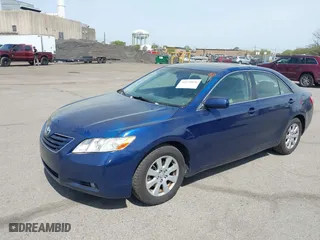 2007 Toyota Camry CE with VIN JTNBE46K373056707, listed as a IAAI auction lot 42128026 with 242,887 mi miles. Bid and sale history available at carsss.com. Image 2.