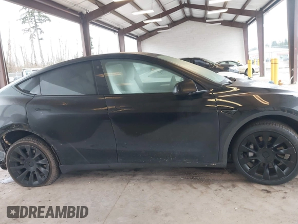 2023 Tesla Model Y Long Range with VIN 7SAYGAEEXPF707503, listed as a IAAI auction lot 41712166 with 27,467 mi miles and . Bid and sale history available at carsss.com. Image 13.