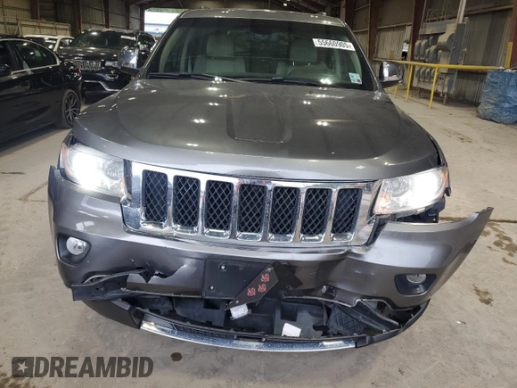 2013 Jeep Grand Cherokee Overland with VIN 1C4RJECT6DC526032, listed as a Copart auction lot 55660905 with 97,406 mi miles and Salvage Title. Bid and sale history available at DreamBid. Image 5.