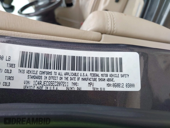 2014 Jeep Grand Cherokee Overland with VIN 1C4RJECG5EC207211, listed as a IAAI auction lot 41586309 with 115,293 mi miles. Bid and sale history available at carsss.com. Image 9.