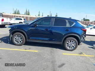 2023 Mazda CX-5 S Carbon Edition z VIN JM3KFBCM7P0197669, wystawiony jako IAAI lot #41992110 z przebiegiem 15 476 mil mil oraz . Historia ofert i sprzedaży dostępna na DreamBid. Obrazek 14.