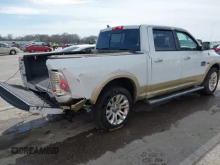 2014 Ram 1500 Longhorn Limited with VIN 1C6RR7PT9ES127063, listed as a IAAI auction lot 41817112 with 126,203 mi miles and . Bid and sale history available at DreamBid. Image 4.