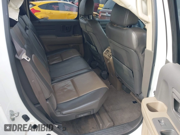 2006 Honda Ridgeline RTL z VIN 2HJYK16586H519593, wystawiony jako IAAI lot #42111678 z przebiegiem 244 962 mil mil oraz . Historia ofert i sprzedaży dostępna na DreamBid. Obrazek 8.