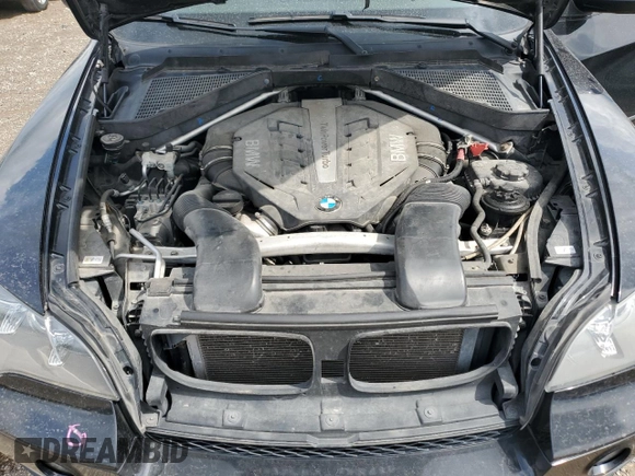 2012 BMW X5 50i with VIN 5UXZV8C51CL424965, listed as a Copart auction lot 64414455 with 121,894 mi miles and Clean title. Bid and sale history available at DreamBid. Image 12.