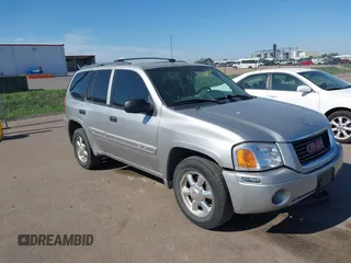2004 GMC Envoy SLT z VIN 1GKDT13S642449872, wystawiony jako IAAI lot #42236157 z przebiegiem 205 194 mil mil oraz . Historia ofert i sprzedaży dostępna na DreamBid. Obrazek 1.