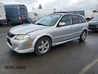 2003 Mazda Protege with VIN JM1BJ245131122002, listed as a Copart auction lot 45060185 with 196,678 mi miles and Salvage Title. Bid and sale history available at DreamBid. Image 1.