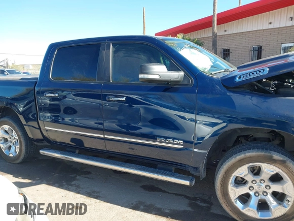 2019 Ram 1500 Big Horn z VIN 1C6RREFT4KN769061, wystawiony jako IAAI lot #41356744 z przebiegiem Nie podano mil oraz . Historia ofert i sprzedaży dostępna na DreamBid. Obrazek 13.