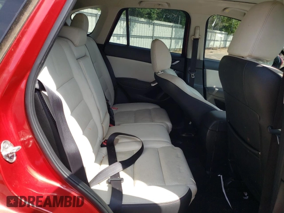 2016 Mazda CX-5 Grand Touring z VIN JM3KE2DY0G0722334, wystawiony jako Copart lot #59998185 z przebiegiem 51 449 mil mil oraz Szkoda całkowita • Salvage title. Historia ofert i sprzedaży dostępna na DreamBid. Obrazek 11.