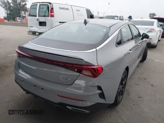 2023 Kia K5 GT-Line z VIN 5XXG64J27PG199321, wystawiony jako IAAI lot #42153677 z przebiegiem 28 798 mil mil oraz . Historia ofert i sprzedaży dostępna na DreamBid. Obrazek 4.