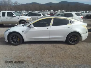 2020 Tesla Model 3 Standard Range Plus with VIN 5YJ3E1EA0LF597839, listed as a IAAI auction lot 41639219 with 49,220 mi miles. Bid and sale history available at carsss.com. Image 15.